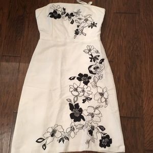 White cocktail dress with black floral detail